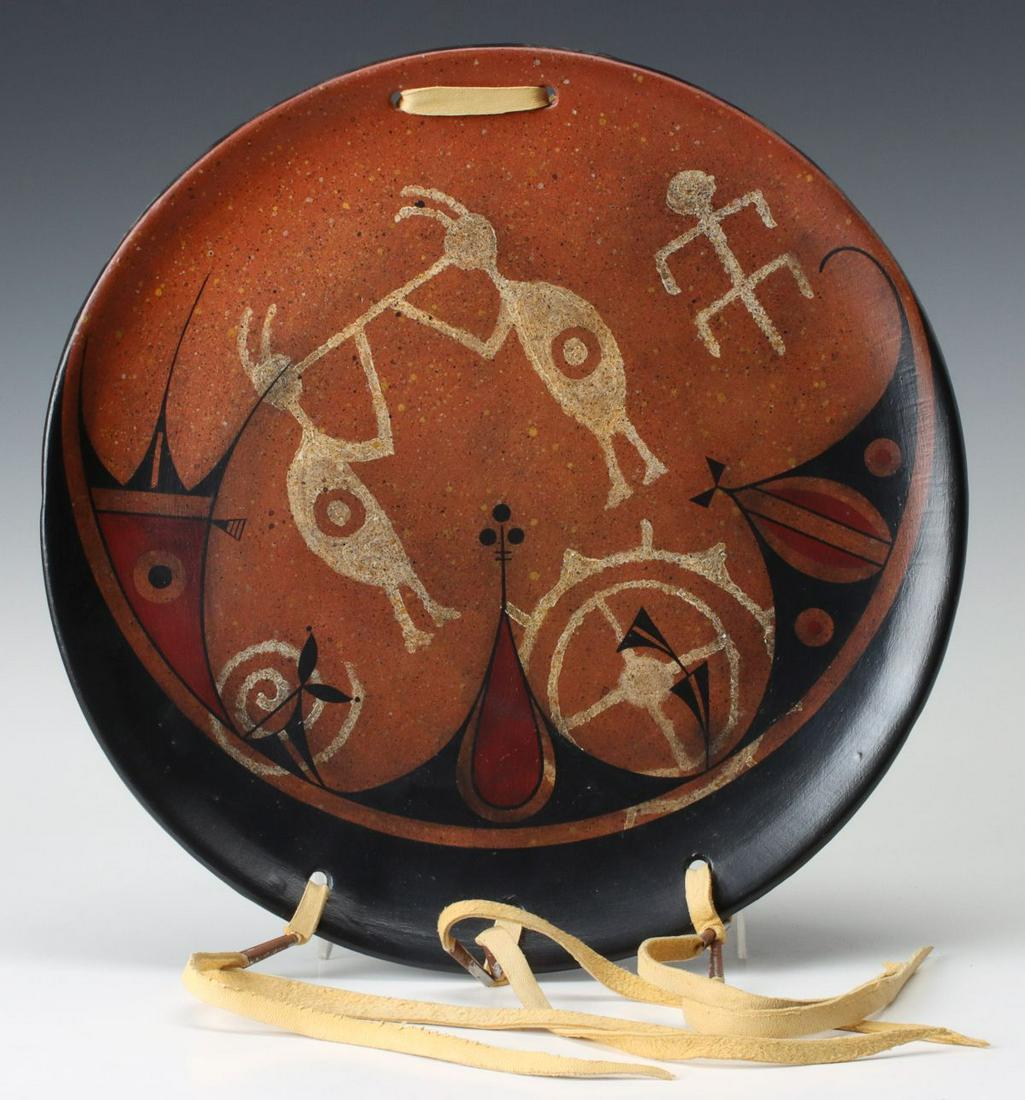 A ZIA PUEBLO CHARGER SIGNED L. ARAGON: A plate signed L. Aragon, ZIA Pueblo. Measures 13 inches in diameter. We happily provide seamless in-house packing and shipping services on nearly everything we sell.