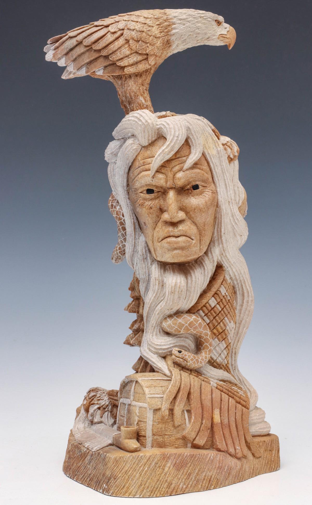 A CARVED STONE SCULPTURE BY IROQUOIS ARTIST LEROY HILL: History of the Firekeepers 1998 The polished and unpolished surfaces highlighting the figures, a carved signature on the base. Measures 13 x 6 inches. We happily provide seamless in-house packing and 