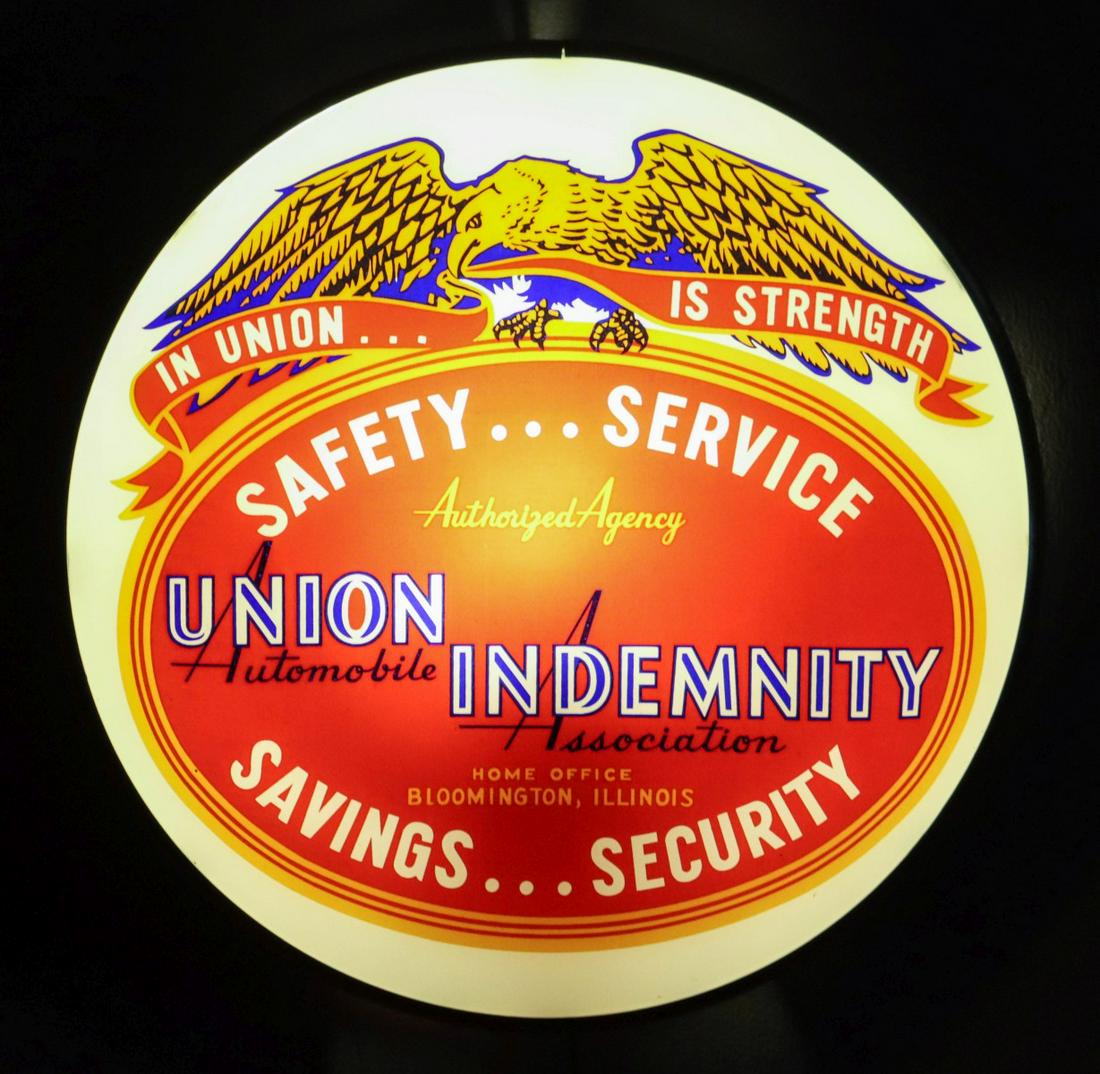 UNION INDEMNITY INSURANCE LIGHTED ADVERTISING SIGN: The mid-20th century lighted bubble glass sign reads 'In Union is Strength, Union Indemnity Automobile Association, Authorized Agency,' four-color printed glass dome housed in a steel case signed Adve
