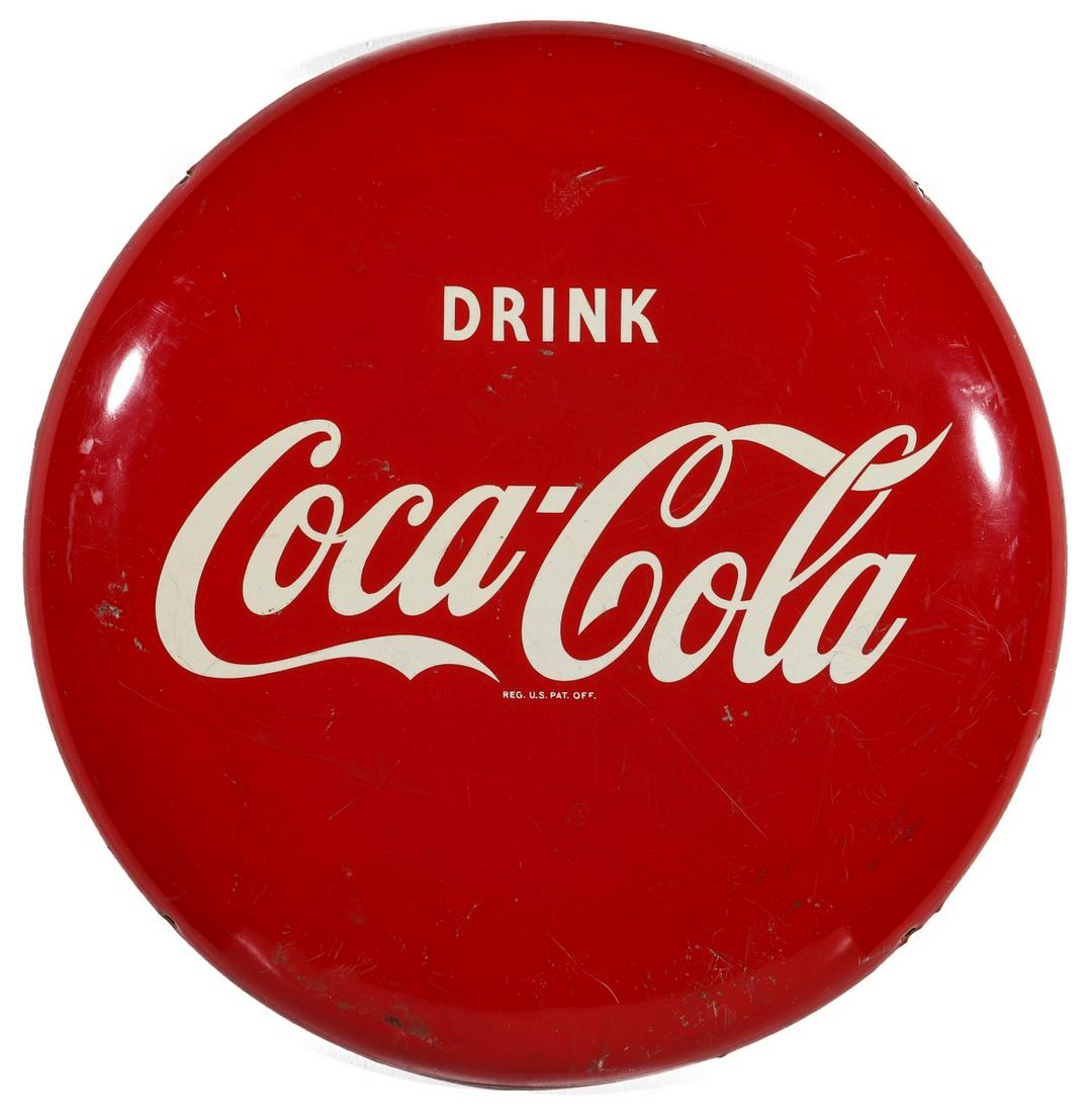 A MID 20TH CENTURY 24-INCH COCA-COLA BUTTON SIGN: The red and white button advertising sign reads 'Drink Coca-Cola,' Petretti number PMS016.002. Measures 24 inches in diameter. We happily provide seamless in-house packing and shipping services on nea