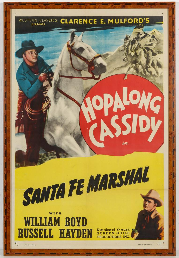 MOVIE POSTER FOR HOPALONG CASSIDY IN SANTA FE MARSHAL: The offset lithograph poster promoting the movie from 1940 with William Boyd and Russell Hayden. Framed in a very nice inlaid bird's eye maple frame. Image measures 38 x 25 with a framed size of 43 x 