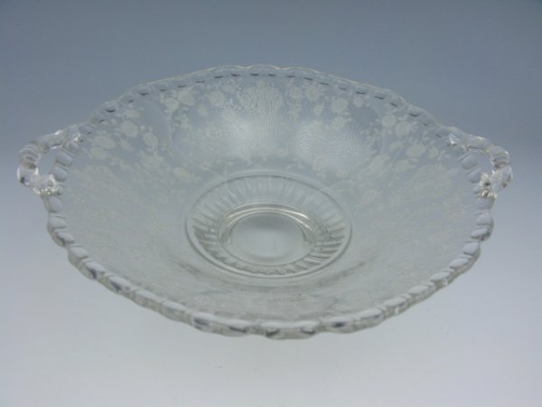 A CAMBRIDGE ROSE POINT CANDY DISH WITH OPEN HANDLE: 2.25 X 9 inches, needlepoint etched Rose Point pattern, very good.