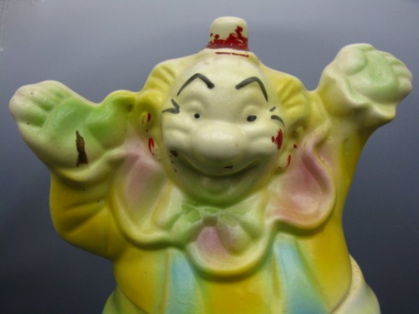 NOVELTY CLOWN PORCELAIN COOKIE JAR: Colorful and glazed porcelain clown cookie jar, unmarked. About 9 x 5 x 12 inches.