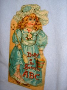 DOLLY AT THE SEASIDE ABC, FATHER TUCK'S DOLL: Father Tuck's DOLL Series. London: Raphael Tuck & Sons, n.d. Light wear along spine.