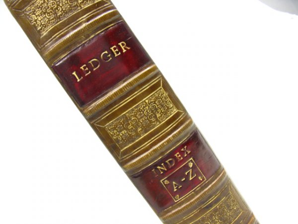 A LEDGER BOX IN THE FORM OF A LEATHER BOOK: Empty box for holding papers