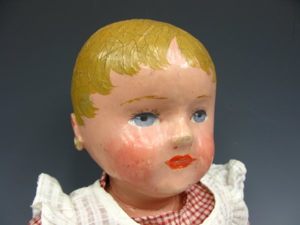 A MARTHA CHASE STOCKINETTE DOLL W/ ORIGINAL PAINT: 19.75 inch length doll, jointed knees and elbows, appears to have all clothes. Enamel painted hair and facial features.