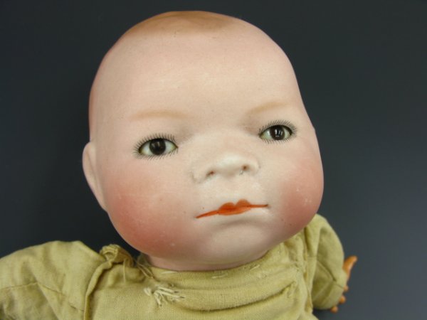 GRACE PUTNAM BYE-LOW PORCELAIN BABY DOLL: Nice 10 x 5 inch doll with "Bye-Low-Baby" stamp to chest. Functioning sleep eyes, nicely finished porcelain head. Incised "Copr by Grace S Putnam" to back of neck.