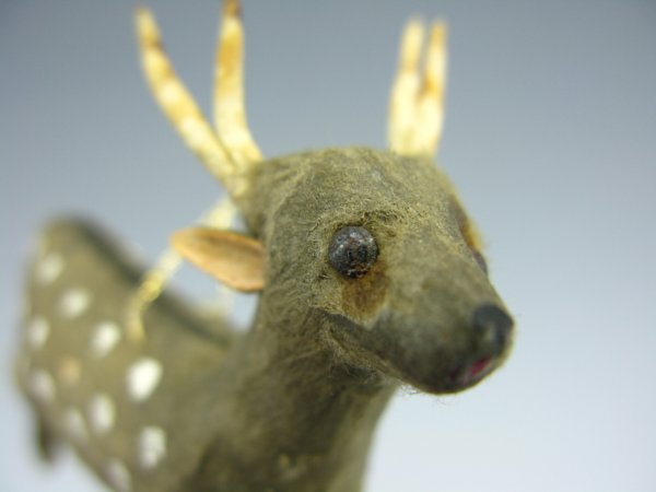 GREY COTTON 4 POINT BUCK CHRISTMAS ORNAMENT: Measures 3 x 3 inches, grey buck with white spots, black stripe and horns. Thread hanger.
