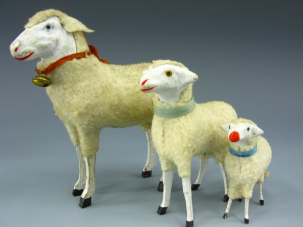 THREE GERMAN COMPOSITION SHEEP, PAPER COLLARS: Includes 5 x 5 inch white sheep with red collar and real bell. 4 x 3.5 inch white sheep and blue collar, 2.5 x 2.5 inch white sheep with "Germany" marked collar.