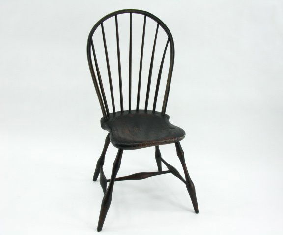 AMERICAN HOOP BACK WINDSOR CHAIR CIRCA 1800: Measures 38 x 14.5 x 15.75 x 17 inches (seat height). Dark finish. Carved seat.