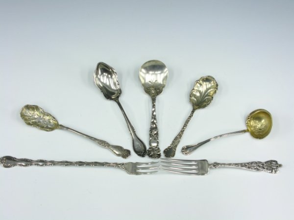 SEVEN STERLING SILVER SPOONS AND FORKS: Includes a 6.5 inch perforated Baird-North spoon, 5.5 inch GM spoon, 5 inch Towle ladle, 5.75 inch Alvin Sterling sugar spoon, 8.25 inch Gorham fork, 6.5 inch Watson fork, 6 inch F.H. Niehaus & Sons s