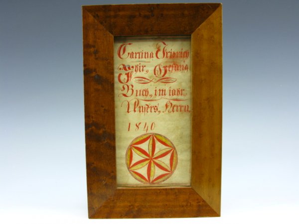 FRAKTUR WATERCOLOR FRAMED DEDICATION 1840: 7.5 x 4.4 inches. Red and blue watercolor hex flower with German inscription about a young girl's songbook.