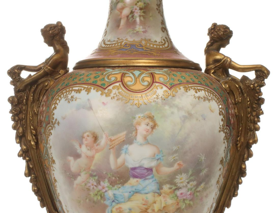 A MONUMENTAL ORMOLU AND PORCELAIN LAMP SIGNED A. COLLOT: The Sevres-style baluster form bolted porcelain urn with ormolu mounts, the body flanked by maiden herm handles at the shoulder, thick raised gilt scrollwork enamels embellishing hand painted scenes o