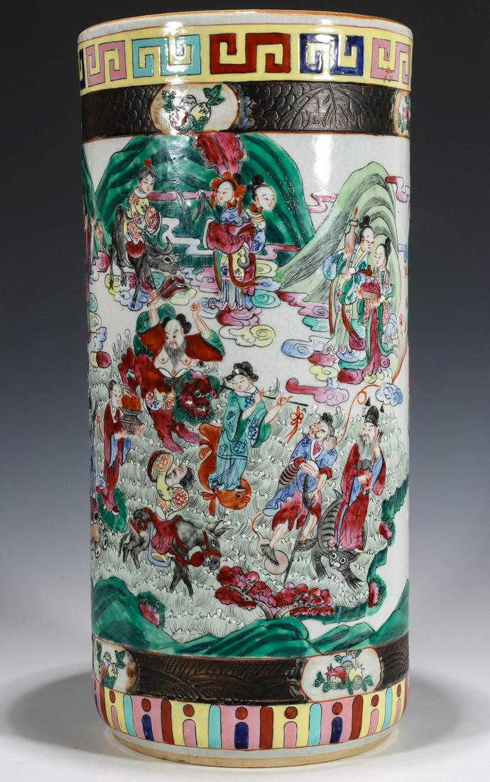 A CHINESE EXPORT PORCELAIN FAMILLE ROSE STICK STAND: The brightly decorated scene around the body with a gathering of Immortals and their acolytes and some animals in a cloud-wreathed mountain landscape, colored bands at rim and foot, the markings on th