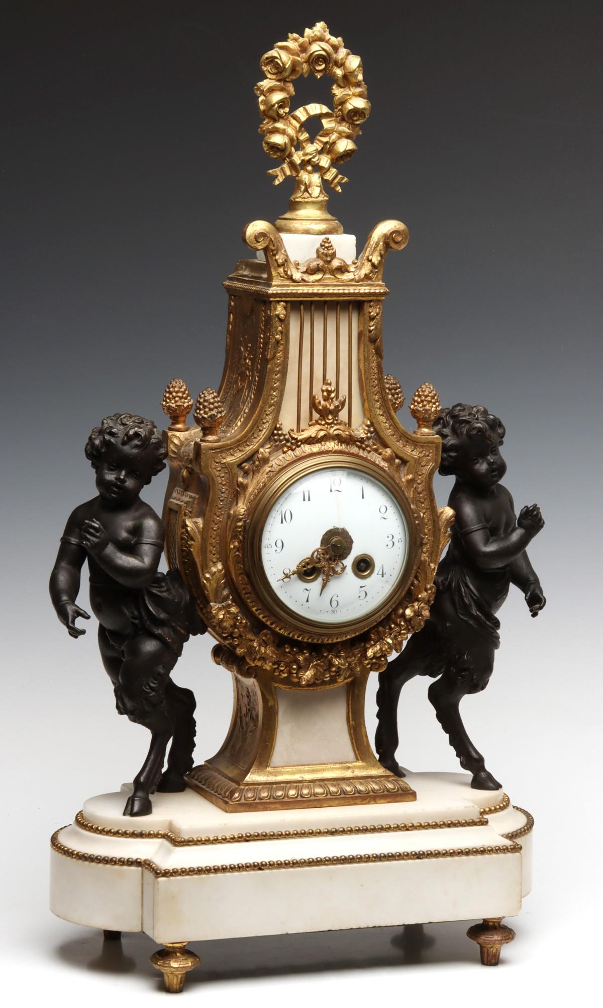 A 19TH C. PARCEL GILT BRONZE LYRE FORM CLOCK WITH PUTTI (1 of 19)