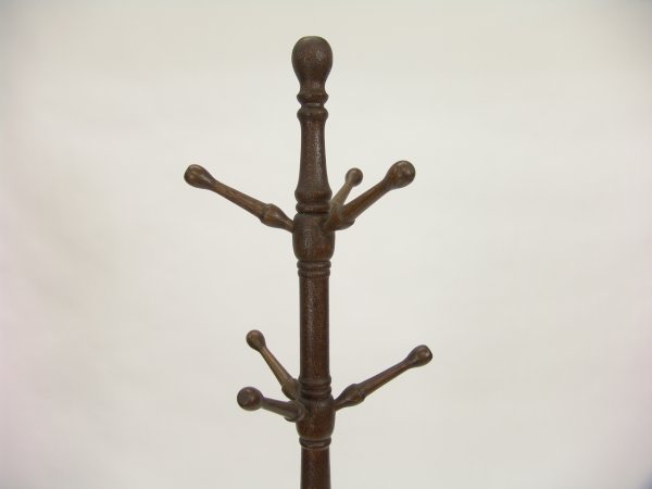 ANTIQUE OAK HALL TREE COAT RACK: Stands 66 inches. Dark wood with, two rows of three pegs, four legs.