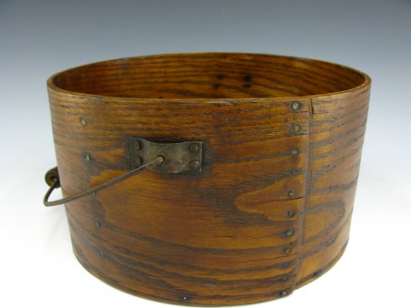 CIRCA 1870 LARGE BAIL-HANDLED PANTRY BOX: Measures 6 x 11 inches, swivel metal handle, nice woodgrain. Probably of Maine origin.