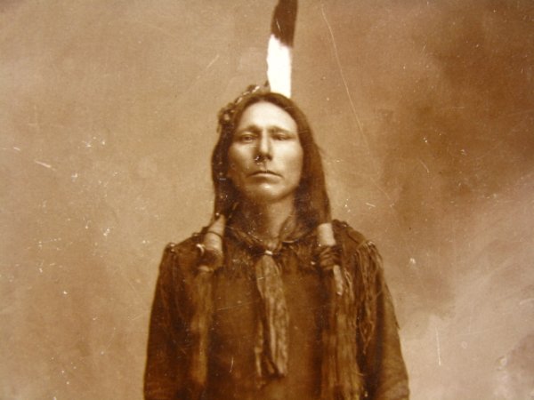 PONCA INDIAN ALBUMEN CABINET PHOTO C. 1890: Nice albumen image from Mistic Studio of a standing man, handwritten ID to back: "Calls him Little Crow." Image size 5.5 x 4 inches, 6.5 x 4.25 inch cardstock.