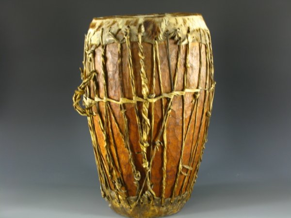 TRIBAL AFRICAN CEREMONIAL ANIMAL HIDE DRUM: 22 x 16 x 12 inches. Double animal hide heads and tension bands.