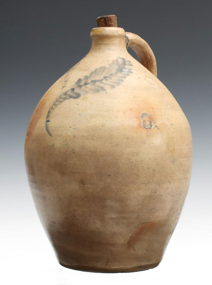 AN EARLY 19TH C. BLUE DECORATED OVOID STONEWARE JUG (1 of 13)