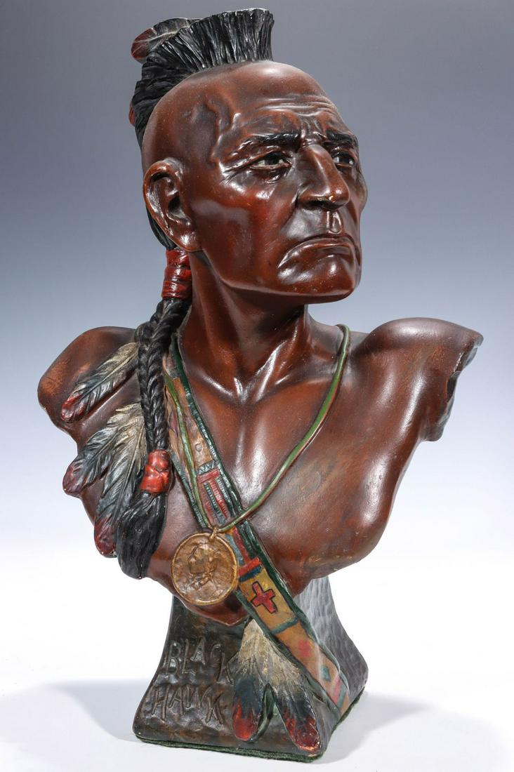 EARLY 20C. POLYCHROME PLASTER CIGAR STORE INDIAN BUST: The countertop figure of Black Hawk with incised mark of Copyright T. Bailey Co 1902. Measures 18 x 11 x 6.50 inches. Provenance: The estate of Glenda St. John. We happily provide seamless in-house pa