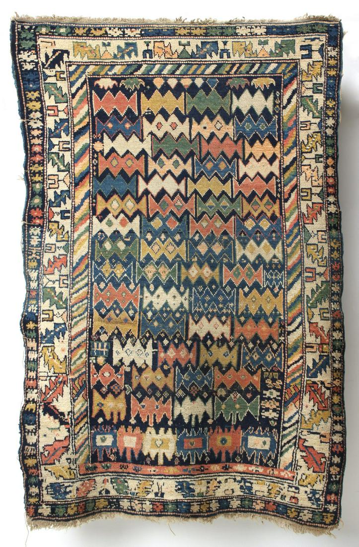 A LIVELY ANTIQUE CAUCASIAN RUG WITH UNUSUAL DESIGN (1 of 11)