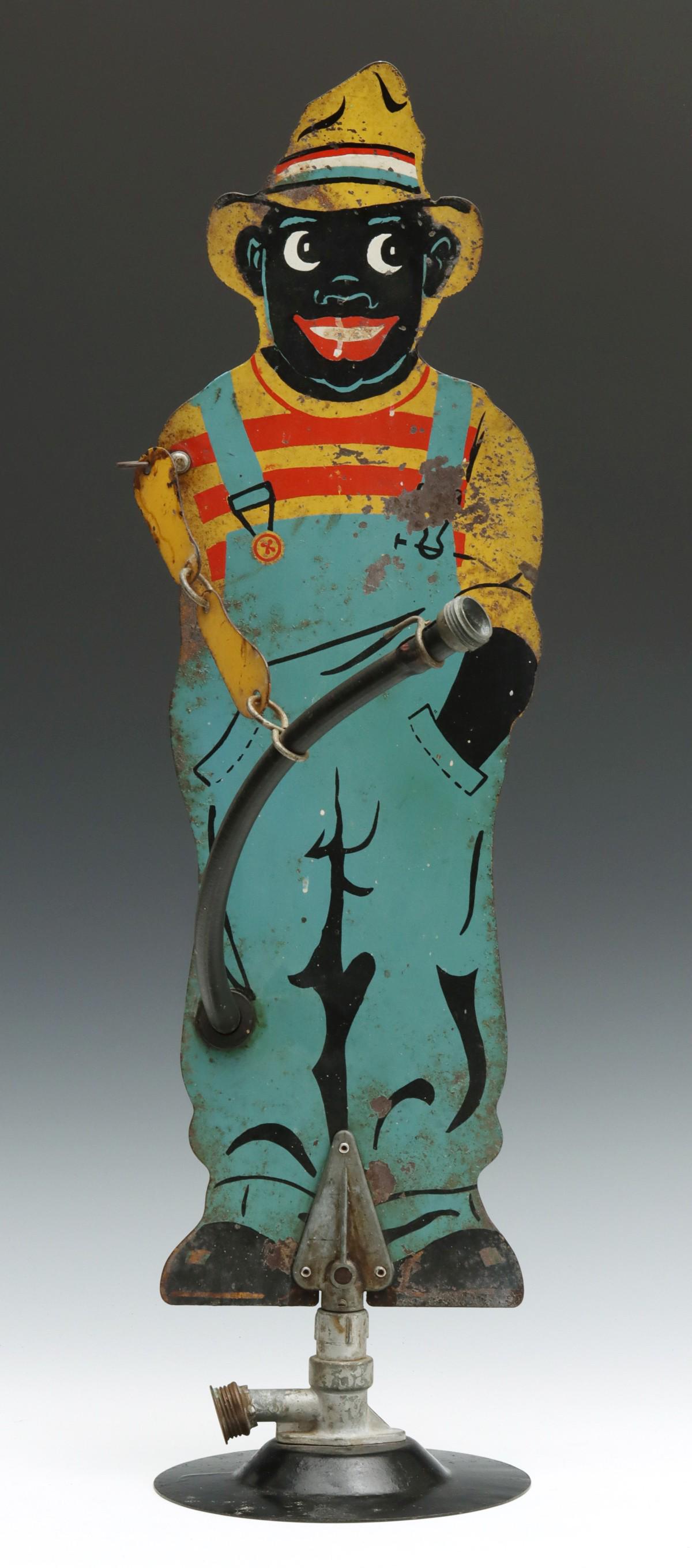 A MID 20TH CENTURY FIGURAL SHEET METAL LAWN SPRINKLER (1 of 10)