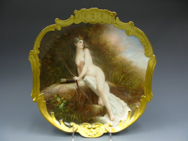 LIMOGES PAINTED PLAQUE SIGNED A. SOUSTRE: Measures 12 inches diameter, color painted image of Diana, Goddess of the Hunt, depicted with bow and quiver of arrows, crescent moon crown (as she eventually became the Goddess of the Moon in mytholo