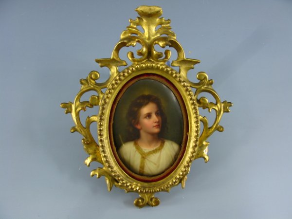 VICTORIAN PAINTED PORCELAIN PORTRAIT OF CHRIST: Image field measures 4 3/4 x 3 1/2 inches, 9 1/2 x 8 1/4 inch porcelain frame. Classical image of a young Christ in robe trimmed in gold. German marks, artist signed Hoffmann and confirmed on reverse.