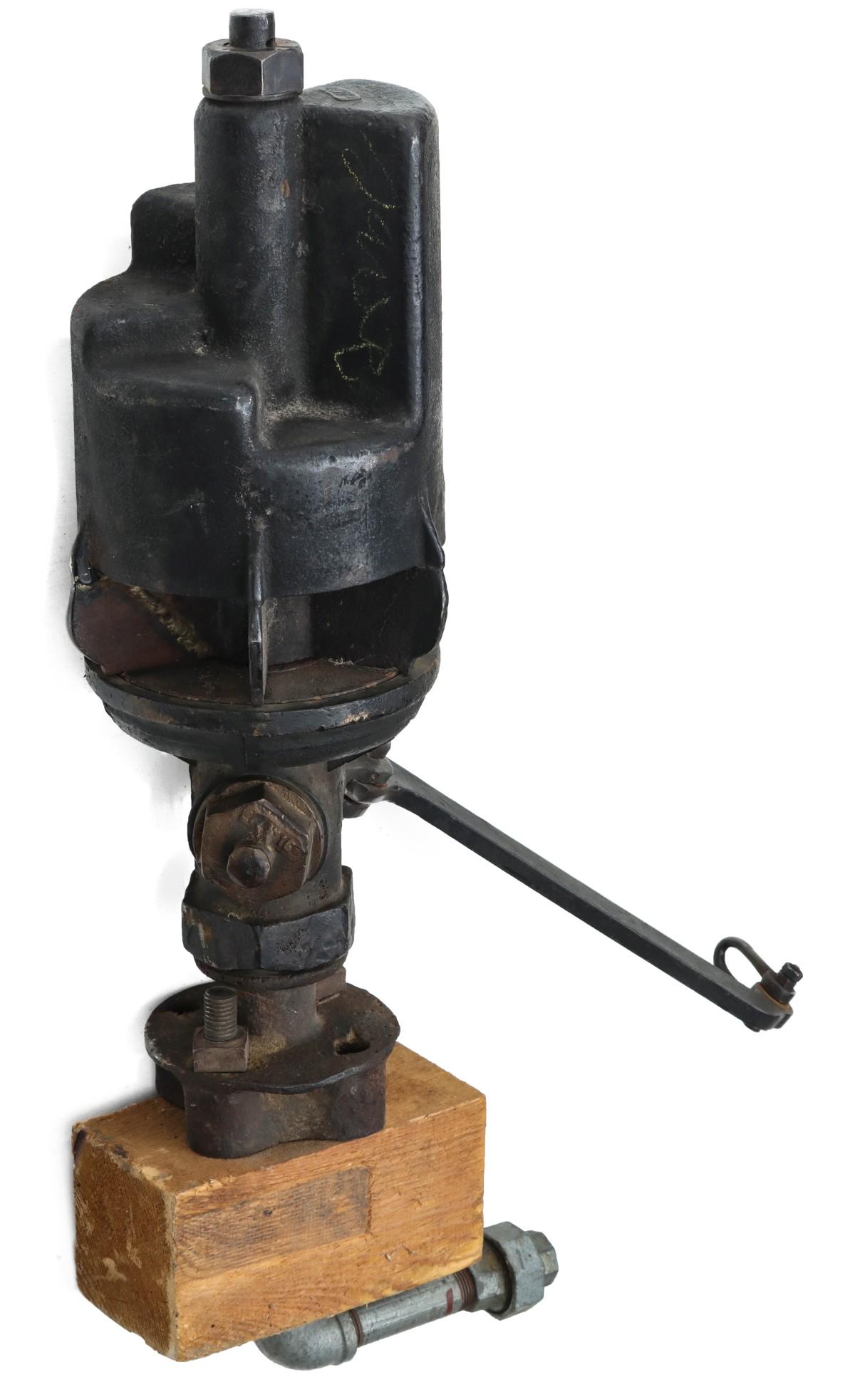 AN UNMARKED FIVE CHIME STEP TOP LOCOMOTIVE WHISTLE: The iron chime on brass valve whistle with lever as shown, with restoration. Valve plate to top measures 12 inches. Diameter measures 6.75 inches. Overall height is 27.5 inches. We happily provide sea