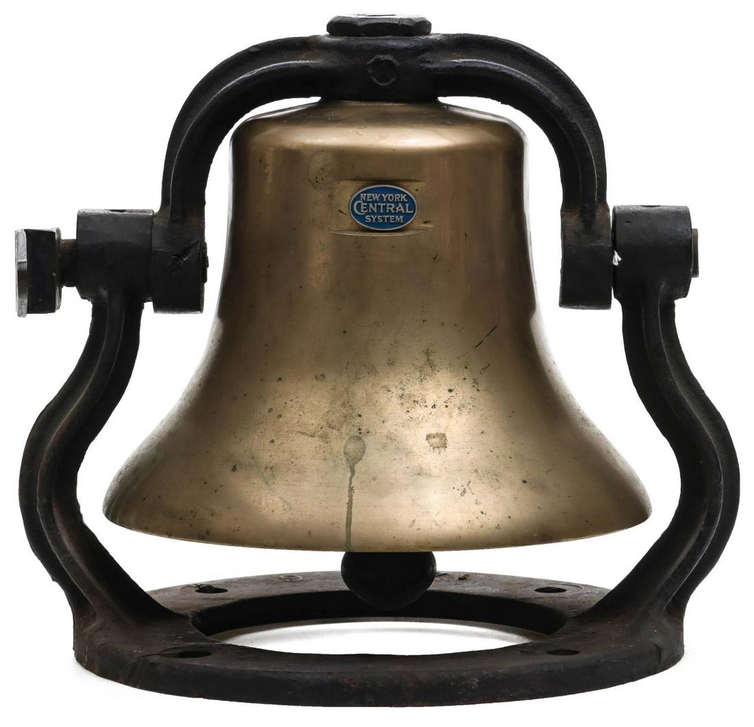 A NEW YORK CENTRAL LOCOMOTIVE BELL ATTR TO MOHAWK 2823: The bronze bell displaying an oval medallion within a recessed frame ground into the bell wall; cast iron yoke with lever arm and distinctive circular base, stamped numerals of 2823 on the bell's top 