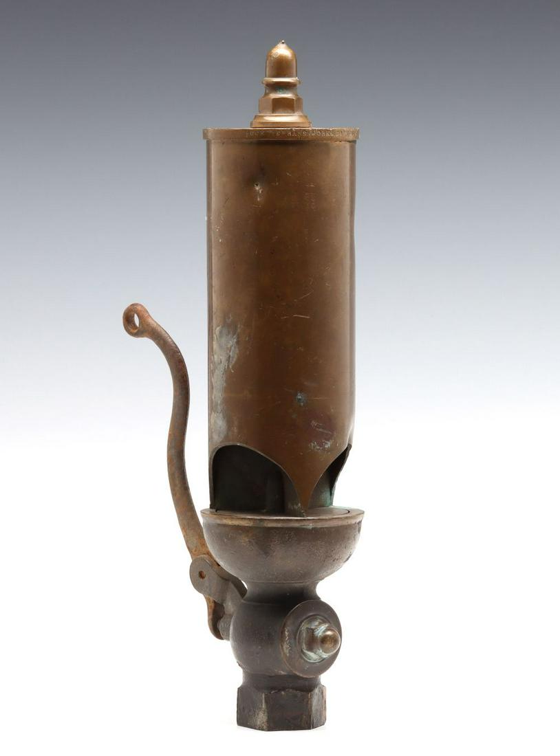 AN ANTIQUE 3-INCH THREE CHIME WHISTLE SIGNED BUCKEYE: The 3-inch diameter three chime flat top whistle with fancy acorn finial, all brass, iron under lever, stamped lettering around the edge of the top plate: BUCKEYE BRASS WORKS. DAYTON. O. Valve plate t