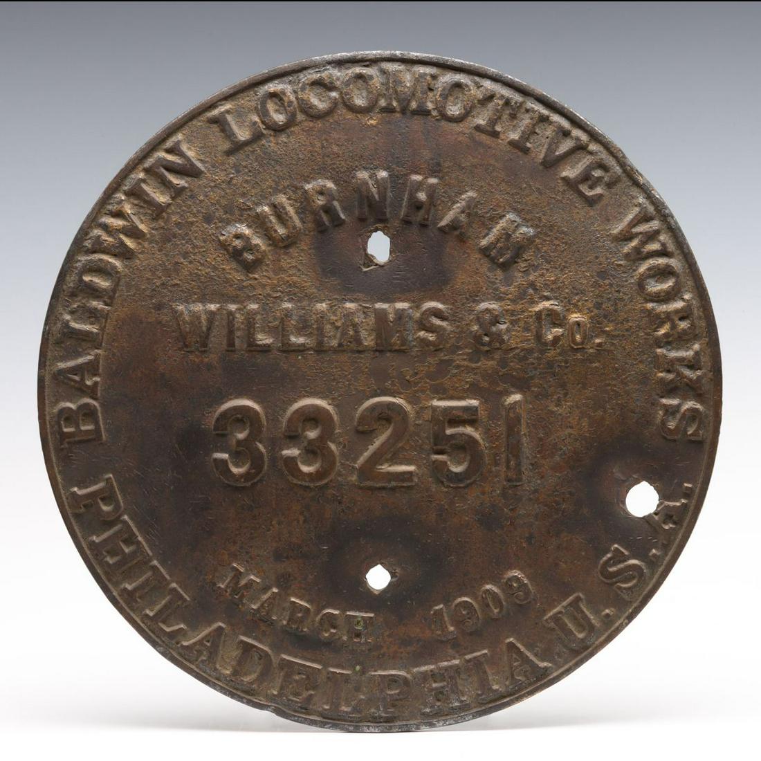 A BALDWIN BUILDER'S PLATE FOR NORTHERN PACIFIC NO. 2151: The circular plate with embossed lettering for Baldwin Locomotive Works Burnham Williams & Co, March 1908 from Northern Pacific Railroad 4-6-2 locomotive number 2151. Measures 12 x 0.5 inches. We happ