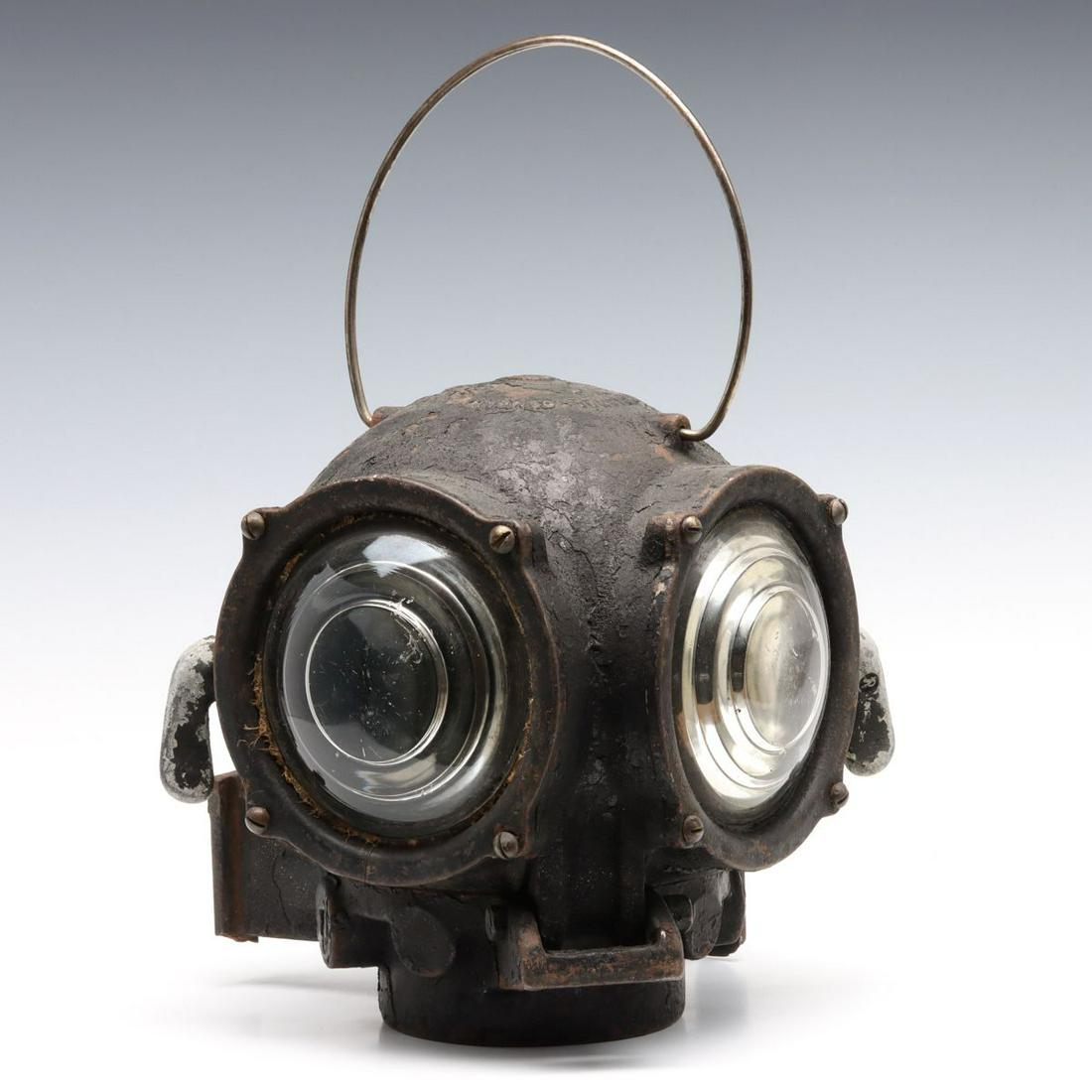 A PYLE NATIONAL CLASSIFICATION LIGHT WITH ATTRIBUTION: The aluminum 'diver helmet' type electrified classification light with paper tag from SANTA FE dated 1959. Measures 10 x 9 x 9 inches. We happily provide seamless in-house packing and shipping service