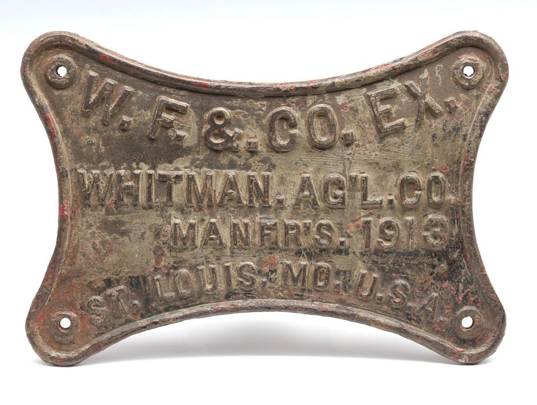 A WELLS FARGO WHITMAN IRON BUILDER'S PLATE DATED 1913: Presumably the type plate found on one of the hundreds of carts made for Wells Fargo by Whitman Agricultural Co., founded in St. Louis, Missouri in the 1870s. Measures 8.5 x 12.5 x 0.5 inches. We happ