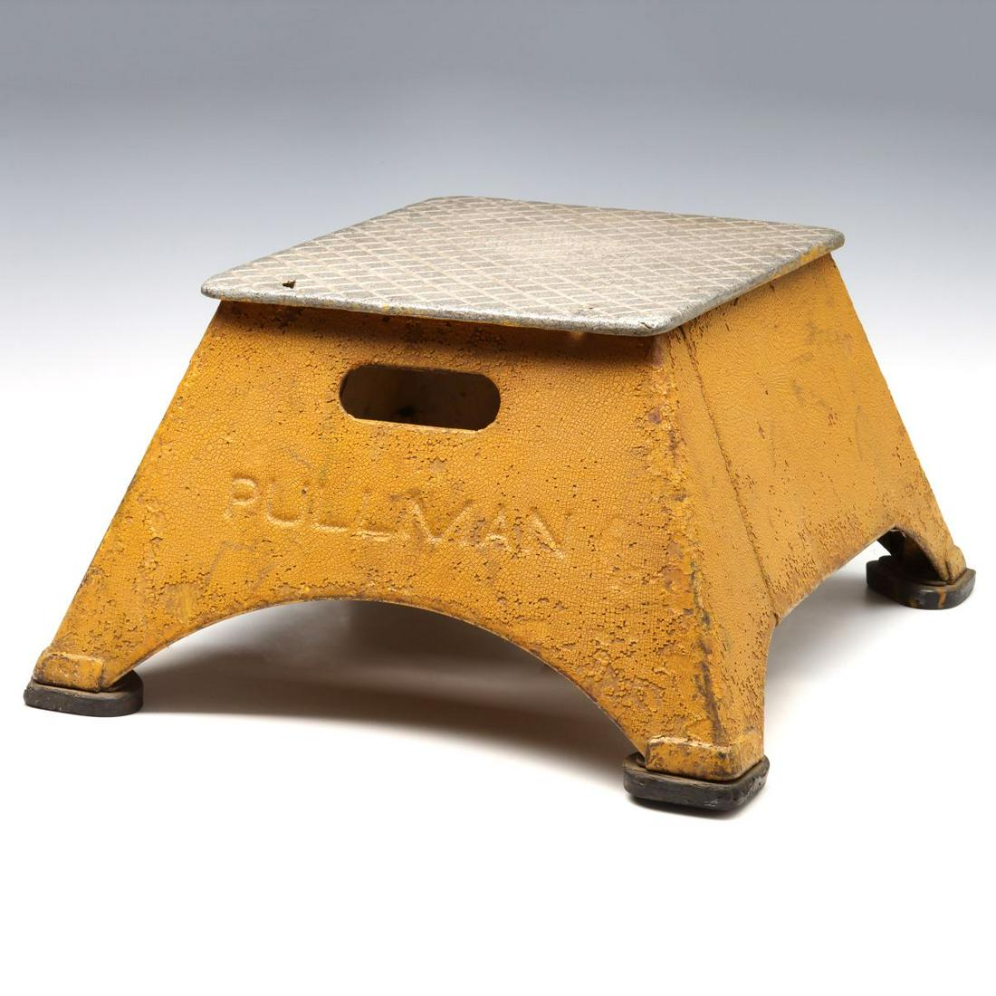 A STEEL AND ALUMINUM RAILROAD STEP BOX MARKED PULLMAN: The Pullman rail car step stool with debossed lettering on one end, open on two sides, a storage compartment is mounted inside along with maker's mark of ALUMALUN A.A.M.CO. N.Y. Measures 10.5 x 20 x 1