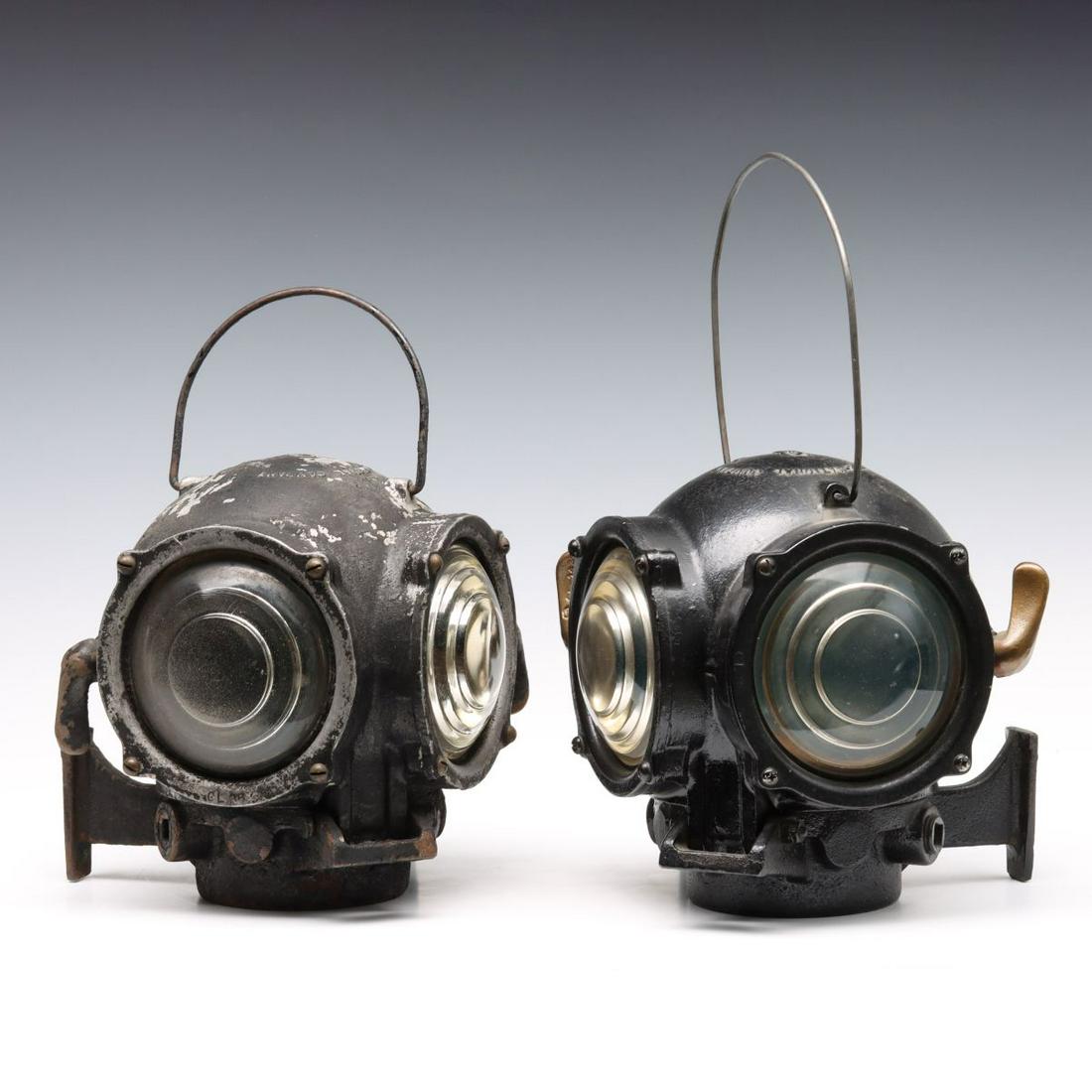 TWO UNMATCHED RAILROAD ENGINE CLASSIFICATION LAMPS: Two 'diver helmet' style housings with Pyle National logo throughout along with other maker's marks, minor variations include brass handle versus aluminum, etc. Both measures 9.5 x 9 x 9 inches. We ha