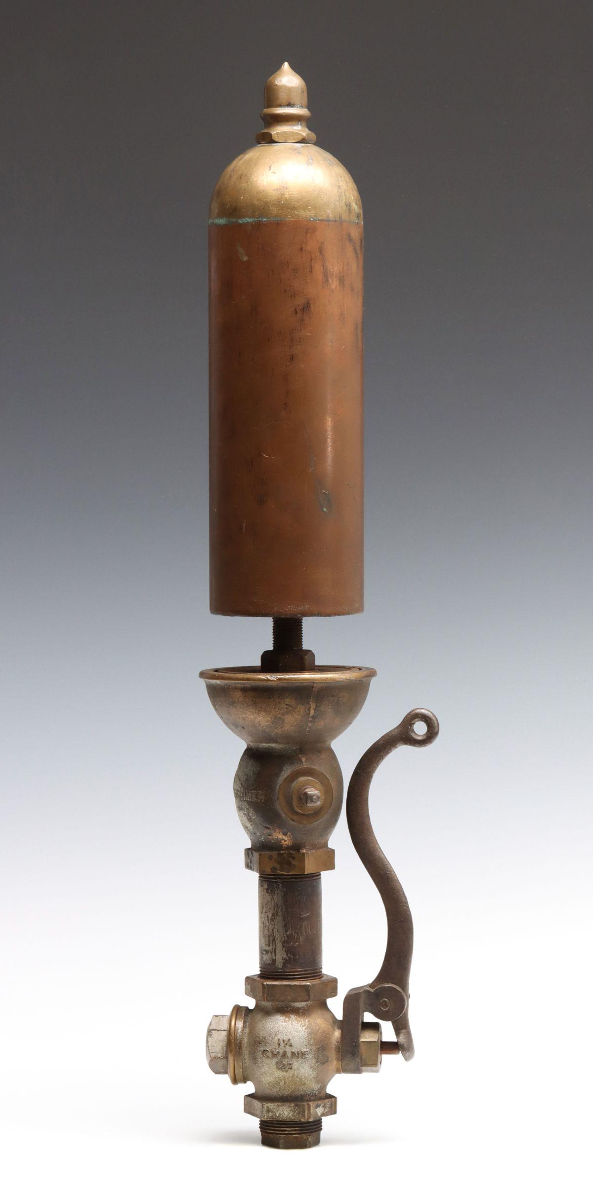 A BRASS SINGLE NOTE STEAM WHISTLE SIGNED LUNKENHEIMER: The 4.25 inch bell with acorn finial on brass bell with maker's mark, extension and lower valve with lever signed Crane. Valve plate to top measures 15.5 inches. Diameter measures 4.25 inches. Overall