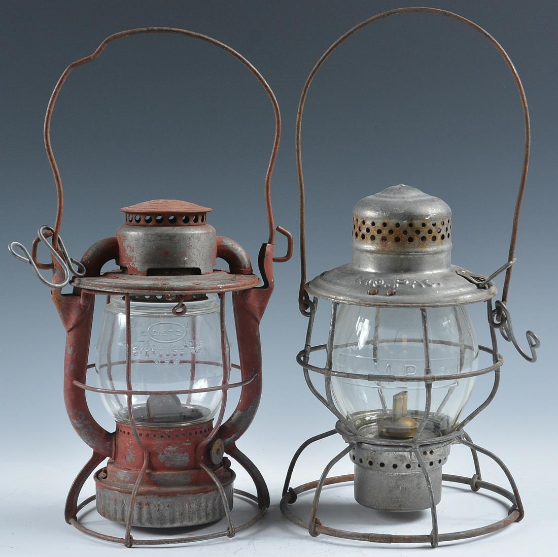 N.Y. CENTRAL AND MoPAC RAILROAD LANTERNS: A Dietz Vesta lantern marked N.Y.C.S. on the shoulder for New York Central, short clear globe cast with the Dietz logo and LITTLE WIZARD. Plus a lantern marked Mo.PAC. for the Missouri Pacific Railroa