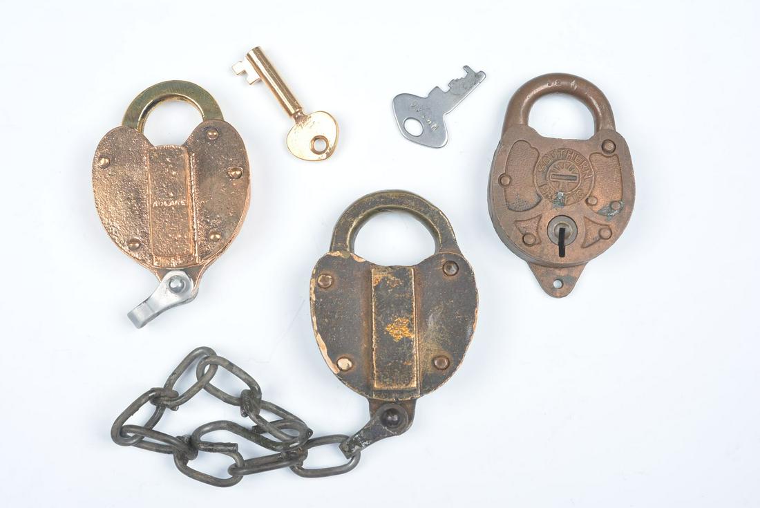 CAST BRASS PADLOCKS WITH RAILROAD MARKINGS: Three railroad padlocks include: An Adlake lock for UNION PACIFIC ROADWAY & BRIDGE DEPARTMENT, with key; An Adlake UNION PACIFIC switch lock, no key; and A SOUTHERN PACIFIC padlock with key. We happil