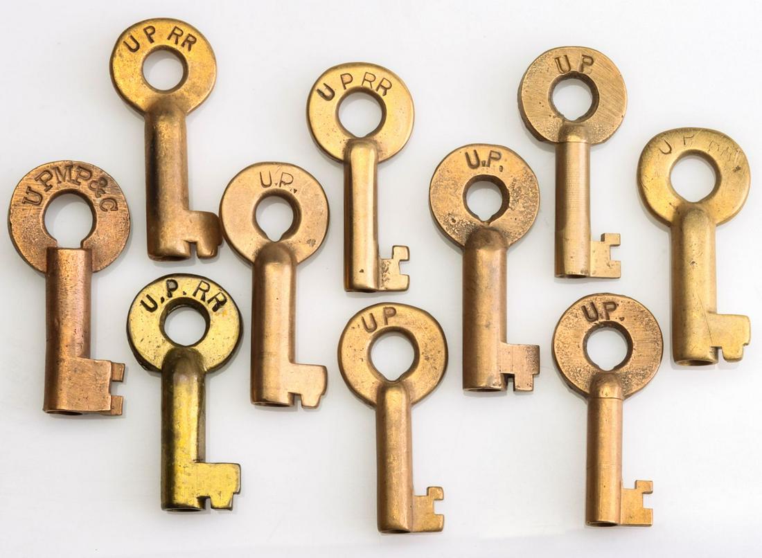 TEN UNION PACIFIC RAILROAD KEYS: Brass keys stamped U.P or U.P.RR., one marked UPMP&C for Union Pacific Motive Power and Car Railroad. We happily provide seamless in-house packing and shipping services on nearly everything we sell.