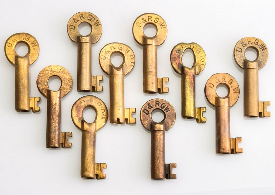 TEN BRASS RAILROAD SWITCH KEYS STAMPED D.&R.G.W.: Ten brass railroad keys stamped D&RGW for the Denver & Rio Grande Western Railroad. We happily provide seamless in-house packing and shipping services on nearly everything we sell.