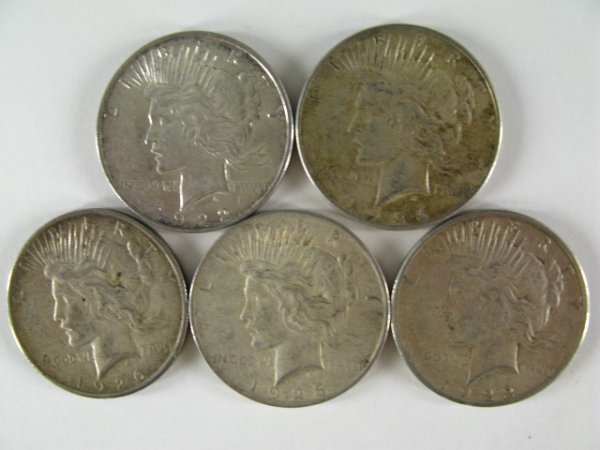 TEN SILVER PEACE DOLLARS: Ten one dollar coins, 1922 D, two 1922 S, two 1923 S, 1923 no mint mark, two 1925 no mint mark, two 1926 S.