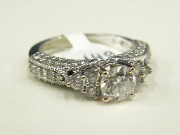 LADY'S 14K DIAMOND BRIDAL FASHION RING: Brilliant cut center is approximately .65 ct. Size 6 1/2. Marked 14 K and 'Love' inside band. Weighs 0.2 oz.