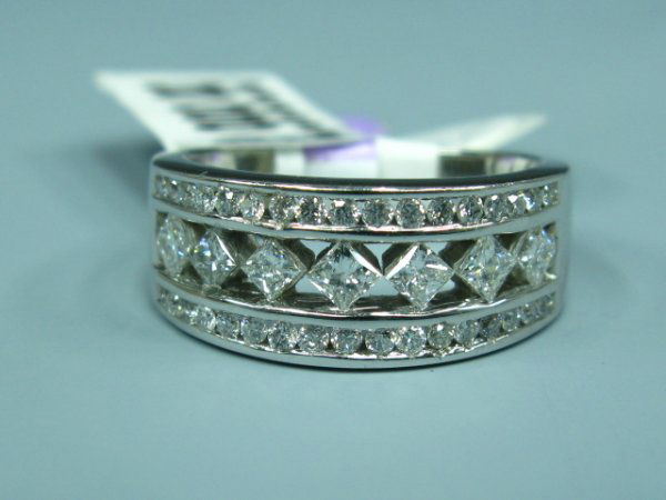 LADY'S 14K DIAMOND FASHION / WEDDING RING: Size 7 1/4. Marked 14K inside band. Weighs 0.2 oz.