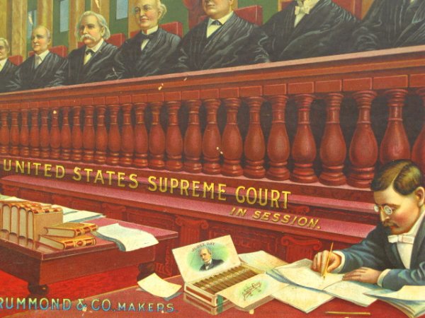1900'S ADVERTISING SIGN FOR JUDGE DAY CIGARS: An antique sign in original period oak frame depicts the Supreme Court hearing a case in the presence of JUDGE DAY CIGARS vis-a-vis an open box near a clerk as well as the words emblazoned on a façad
