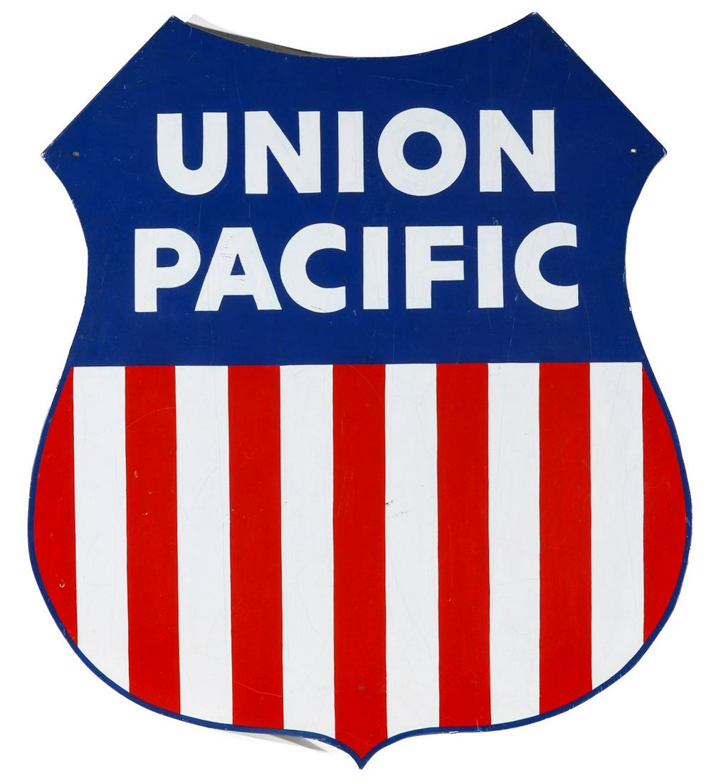 A PAINTED ALUMINUM UNION PACIFIC SHIELD SHAPE SIGN: The thick aluminum sign as shield logo with graphics and lettering from the later period. Measures 44.5 x 37 inches. We happily provide seamless in-house packing and shipping services on nearly everyt