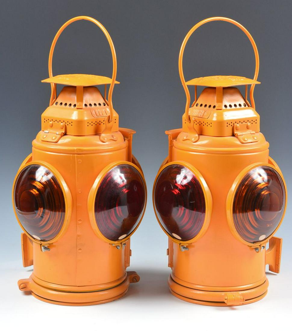 A PAIR OF COACH/CABOOSE TAIL LAMPS MARKED G.M.&O.: The pair of left and right Adlake tail lamps marked GM&O for the Gulf Mobile & Ohio Railroad. We happily provide seamless in-house packing and shipping services on nearly everything we sell.