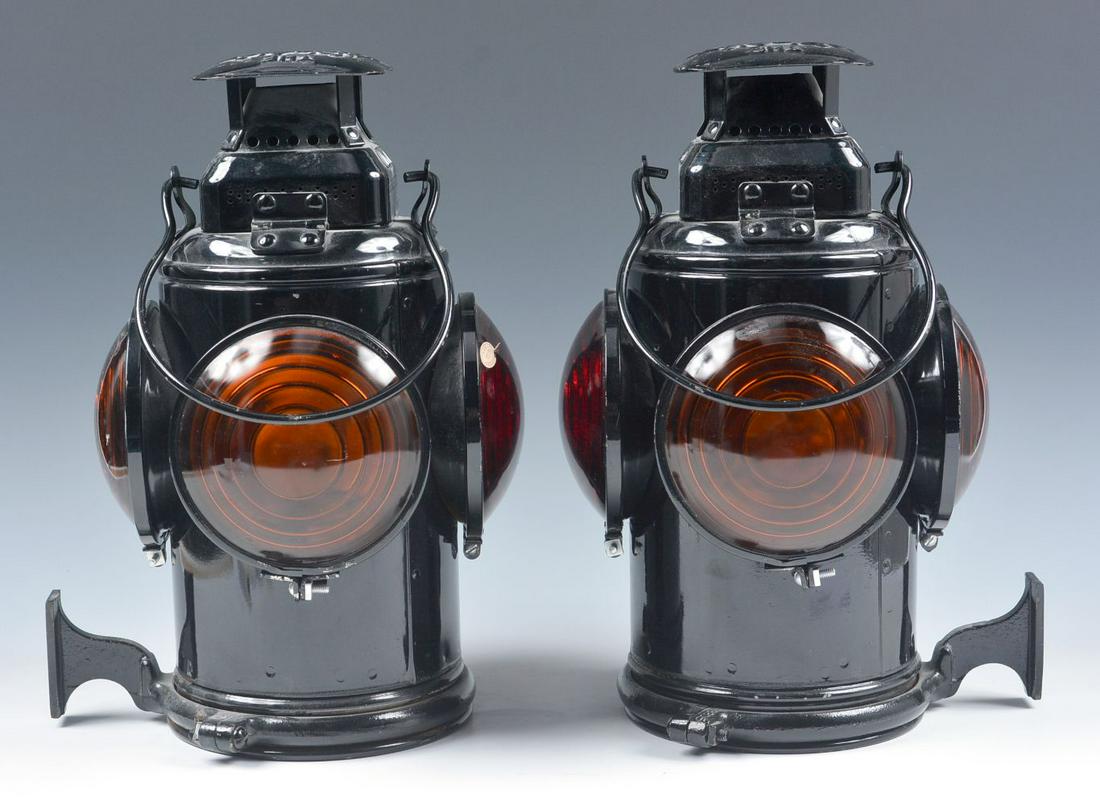 A PAIR OF COACH/CABOOSE TAIL LAMPS MARKED G.M.&O.: The pair of left and right Adlake tail lamps with red and yellow lenses marked GM&O for the Gulf Mobile & Ohio Railroad. We happily provide seamless in-house packing and shipping services on nearly ev