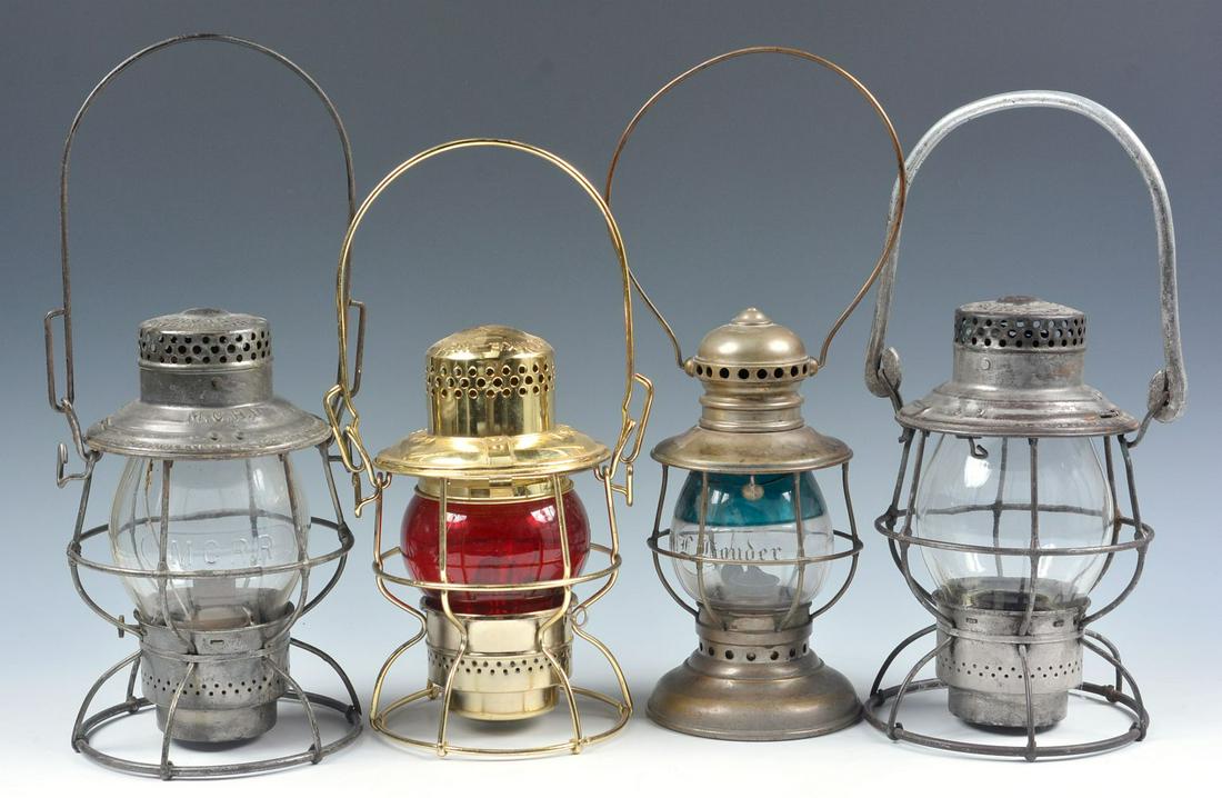 M.C. RR, B&O RR AND A DAMAGED PRESENTATION LANTERN: Includes: An Adlake Reliable lantern frame marked M.C.R.R. on the shoulder, tall clear globe cast M.C.RR for Maine Central or Michigan Central.; a reproduction brass commemorative lantern marked EJ&E 